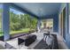 Comfortable screened porch offers relaxing views of the lush, natural landscape at 4383 Ortona Ln, Wesley Chapel, FL 33543