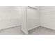 Empty walk-in closet, equipped with shelving, offers ample storage space at 4383 Ortona Ln, Wesley Chapel, FL 33543
