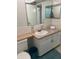 Bathroom with a vanity, large mirror, and storage at 5155 9Th N Ave # 311, St Petersburg, FL 33710