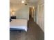 Bedroom with neutral walls, plush carpeting, and ample closet space at 5155 9Th N Ave # 311, St Petersburg, FL 33710