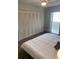 Bedroom with neutral walls, carpet, and closet at 5155 9Th N Ave # 311, St Petersburg, FL 33710
