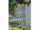 View of the apartment featuring balconies, white railings, and a decorative white privacy screen at 5155 9Th N Ave # 311, St Petersburg, FL 33710