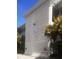 The exterior showcases the architectural details of Disston Arms beneath clear blue skies at 5155 9Th N Ave # 311, St Petersburg, FL 33710