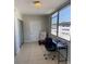 Well-lit living space featuring tile floors, large windows, and neutral wall paint at 5155 9Th N Ave # 311, St Petersburg, FL 33710