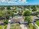 An aerial view showcases a cozy single Gathering home with a fenced yard and attached garage, ideal for comfortable living at 540 Firefly Ln, Apollo Beach, FL 33572