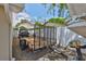 Storage area featuring an open trailer and a boat on a trailer, behind a fence at 540 Firefly Ln, Apollo Beach, FL 33572