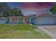Eye-catching single-story home with bright accents and a well-maintained front yard at 540 Firefly Ln, Apollo Beach, FL 33572