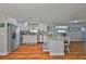Modern kitchen with white cabinets, stainless steel appliances, and a granite countertop island with bar seating at 540 Firefly Ln, Apollo Beach, FL 33572
