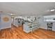 Open-concept kitchen features a granite countertop island with barstool seating at 540 Firefly Ln, Apollo Beach, FL 33572