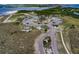 Aerial view of the parking lot, picnic area, boardwalk, and lookout tower at Apollo Beach Nature Preserve at 540 Firefly Ln, Apollo Beach, FL 33572