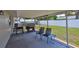 Relaxing covered patio area with grill and ample space for outdoor enjoyment at 540 Firefly Ln, Apollo Beach, FL 33572