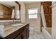 Bathroom with granite counters, tiled shower, and marble floors at 5483 37Th N Ave, St Petersburg, FL 33710