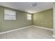 Neutral bedroom with two windows and tile flooring at 5483 37Th N Ave, St Petersburg, FL 33710
