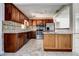 Updated kitchen boasts stainless appliances, granite counters, tile backsplash, and ample cabinet space at 5483 37Th N Ave, St Petersburg, FL 33710