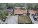 Overhead view of home, showcasing its well-manicured lawn, driveway, and proximity to neighboring houses at 5533 Golden Nugget Dr, Holiday, FL 34690