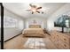 Bright bedroom featuring a ceiling fan, neutral paint, and lots of natural light at 5533 Golden Nugget Dr, Holiday, FL 34690