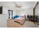 Cozy bedroom with ceiling fan, carpet, and bright natural light at 5533 Golden Nugget Dr, Holiday, FL 34690