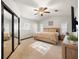 Cozy bedroom featuring a ceiling fan, mirrored closet doors, and natural light at 5533 Golden Nugget Dr, Holiday, FL 34690