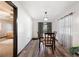 Formal dining room with wood floors, neutral paint, and modern light fixture at 5533 Golden Nugget Dr, Holiday, FL 34690