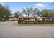 Charming single-Gathering home featuring a well-kept lawn and inviting curb appeal with a picket fence at 5533 Golden Nugget Dr, Holiday, FL 34690