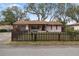 Charming single-story home with a well-maintained front yard and quaint picket fence at 5533 Golden Nugget Dr, Holiday, FL 34690