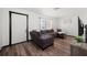 Inviting living room with a brown sectional, wood floors and a large window at 5533 Golden Nugget Dr, Holiday, FL 34690