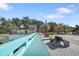 Scenic view of New Port Richey with a riverside path and well-manicured landscaping at 5533 Golden Nugget Dr, Holiday, FL 34690