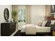 Tastefully designed bedroom featuring a dresser, bed, and bright natural lighting at 5676 Red Kite Dr, Wimauma, FL 33598