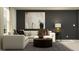 Inviting living room with stylish sofa, decorative pillows, artwork, and modern lighting at 5676 Red Kite Dr, Wimauma, FL 33598