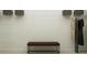 Walk-in closet with shelves, hanging rods, a cushioned bench, and ample storage space at 5676 Red Kite Dr, Wimauma, FL 33598