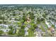 An aerial view captures a charming home set among lush greenery in a peaceful, residential area at 6195 28Th N Ave, St Petersburg, FL 33710