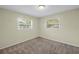 Comfortable carpeted bedroom with large windows at 6195 28Th N Ave, St Petersburg, FL 33710