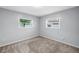 Carpeted bedroom with two sunny windows at 6195 28Th N Ave, St Petersburg, FL 33710