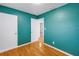 Teal-colored bedroom with hardwood floors and closet at 6195 28Th N Ave, St Petersburg, FL 33710