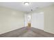 Carpeted bedroom features a closet and view to ensuite bath at 6195 28Th N Ave, St Petersburg, FL 33710