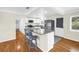Bright kitchen boasts granite countertops, white cabinetry, stainless appliances and a breakfast bar with seating at 6195 28Th N Ave, St Petersburg, FL 33710