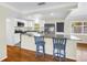A kitchen with white cabinets, stainless steel appliances, and an island with seating at 6195 28Th N Ave, St Petersburg, FL 33710