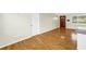 Hardwood floor living area with a wood door and a large window at 6195 28Th N Ave, St Petersburg, FL 33710