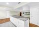 An open-concept design with granite island and hardwood floors into the main living area at 6195 28Th N Ave, St Petersburg, FL 33710
