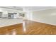 Open-concept living room flows to the kitchen with hardwood floors, modern appliances, and natural light at 6195 28Th N Ave, St Petersburg, FL 33710