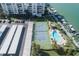 Aerial view of community with pool, tennis court, and boat slips at 660 Island Way #206 # 206, Clearwater, FL 33767