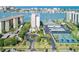 A beautiful waterfront condo complex featuring mature landscaping, covered parking, and tennis courts at 660 Island Way #206 # 206, Clearwater, FL 33767