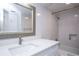 Bathroom featuring a white vanity and tiled shower-tub combination at 660 Island Way #206 # 206, Clearwater, FL 33767