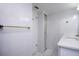 Small white bathroom with glass shower at 660 Island Way #206 # 206, Clearwater, FL 33767