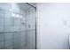 Bathroom with tiled shower featuring glass door, and showerhead at 660 Island Way #206 # 206, Clearwater, FL 33767
