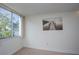 Bedroom featuring a large picture window and serene lake view at 660 Island Way #206 # 206, Clearwater, FL 33767