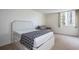 Bright bedroom with a queen size bed, chair, and large window with lots of natural light at 660 Island Way #206 # 206, Clearwater, FL 33767