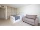 Cozy bedroom featuring built-in storage and a comfortable seating area at 660 Island Way #206 # 206, Clearwater, FL 33767