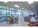 Spacious clubhouse with a card table, lounge area, large windows, and views of the surrounding landscape at 660 Island Way #206 # 206, Clearwater, FL 33767