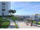 Exterior view of picnic tables with a scenic waterfront and marina view at 660 Island Way #206 # 206, Clearwater, FL 33767